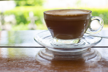 Cappuccino coffee on old wooden table and roasted coffee beans - Image