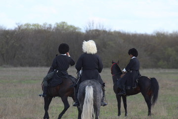 Race horses and riders on them.