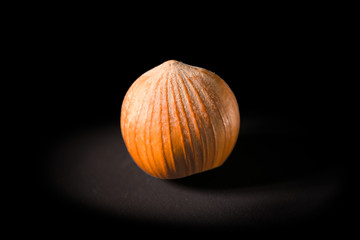 A hazelnut isolated on a black background
