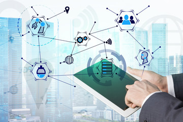 Businessman hand on tablet, GUI in city