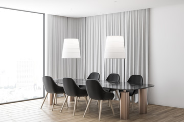 Gray curtain dining room corner, black chairs
