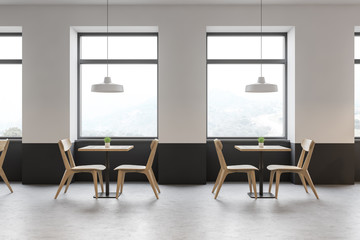 White and gray cafe interior with mountain view