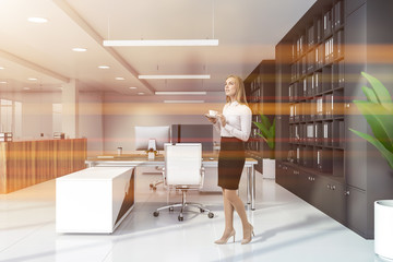 Woman in office with bookcases