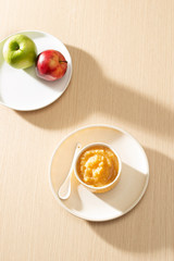 Natural baby food concept. Bowl of apple baby puree.