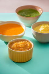 Homemade vegetable baby food purees in glass jars