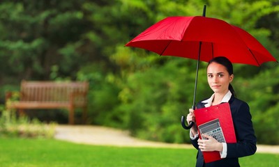 Beautiful businesswoman portrait with umbrella , isolated.