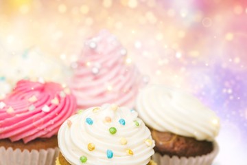 Obraz na płótnie Canvas Tasty Colorful cupcakes on background