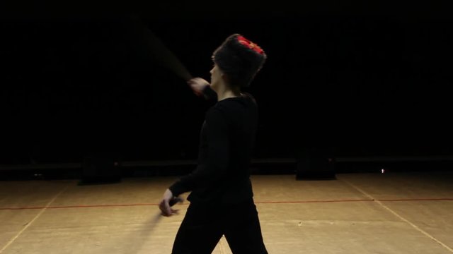 Guy dancing with swords