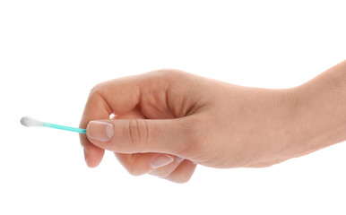 Woman holding used cotton swab on white background, closeup