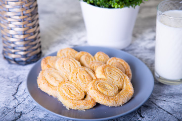 Cottage cheese homemade cookie in sugar topping. Marble background. Selective focus, close-up.