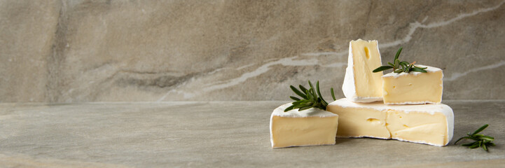 Cheese camembert or brie with fresh rosemary - obrazy, fototapety, plakaty