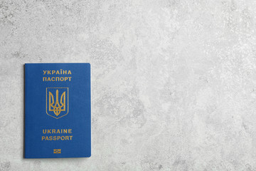 Ukrainian travel passport on grey background, top view with space for text. International relationships