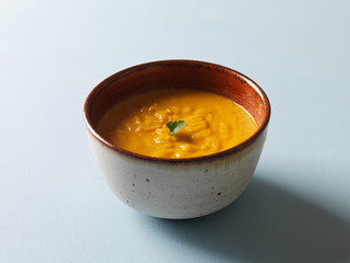 Pumpkin Soup on pastel blue background
