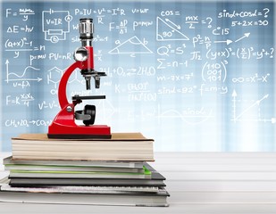 Medical equipment. microscope and books  on Background