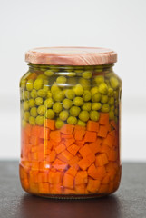 Peas and carrots food in jar still life