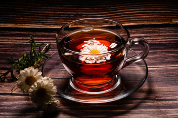 cup of tea with chamomile flowers