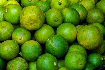 Close Up Fresh Green Lemon Limes at the market