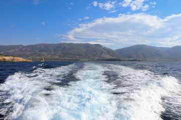 Naklejka na ściany i meble During summer vacation traveling by yacht from the Poros island, Saronic Gulf, Greece.