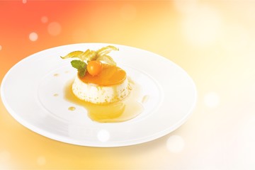 Caramel custard with cream and  topping.