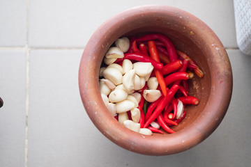 Chili and garlic in mortar close up