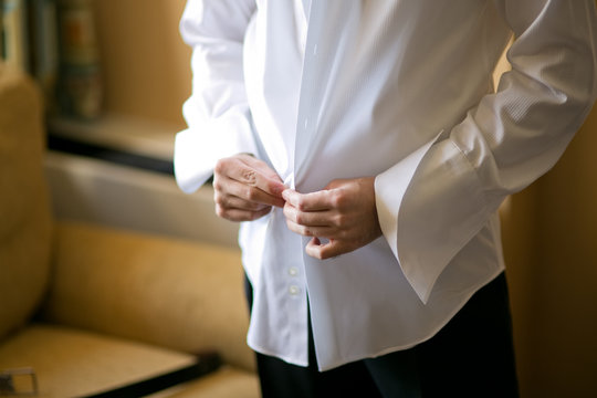 Man dressing in formal atire