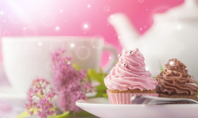 Delicious cupcakes with cream and tea set