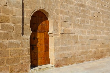 old door in stone wall