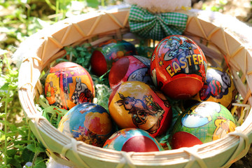 easter eggs in wooden basket with stuffed bunny
