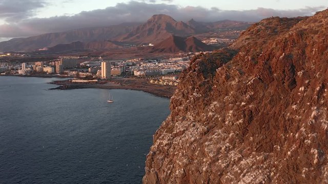 Beautiful aerial view of the south coast of Tenerife and the town of Los Cristianos at sunset