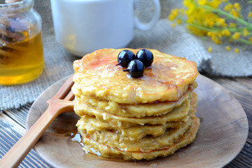 Stack of oatmeal pancake with honey and berries Healthy delicious breakfast