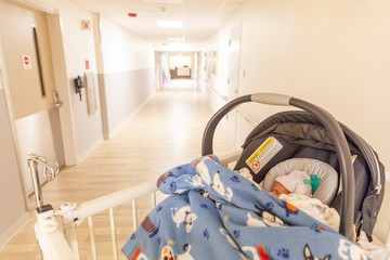 baby in car seat in hospital