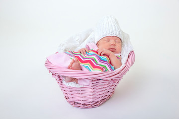 baby sleeping in basket