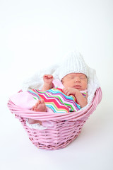 baby sleeping in basket