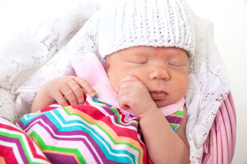 baby sleeping in basket