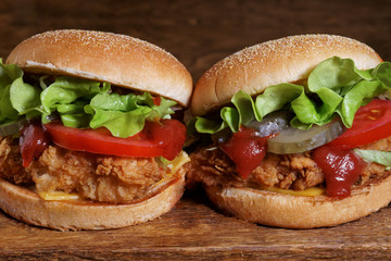 juicy beef burger, french fries, wooden board