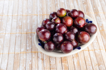 fruits of jaboticaba in bowl on the table