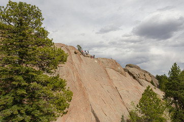 Group Ready to Rappel Down Granite Face