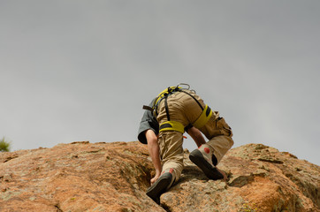 Top Rope Rock Climber Ascending Granite