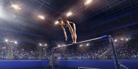 Female athlete doing a complicated exciting trick on horizontal gymnastics bars in a professional...