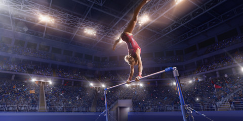 Female athlete doing a complicated exciting trick on horizontal gymnastics bars in a professional...