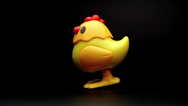 Clockwork yellow toy chicken.