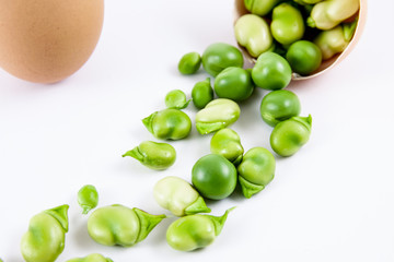 close-up shot of composition fresh vegetables and assortment of beans and peas, still life with white background