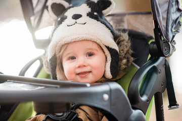 Portrait of baby girl in stroller