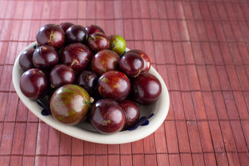 fruits of jaboticaba in bowl on the table
