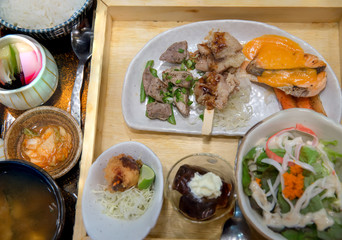 japanese bento set. Bento set of prawn tempura and chicken teriyaki in japanese restaurant. 