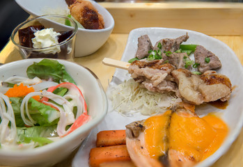 japanese bento set. Bento set of prawn tempura and chicken teriyaki in japanese restaurant. 