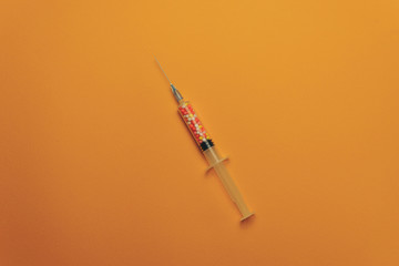 Syringe with color drugs ( vitamins, dyes, flavor enhancers, nutritional supplements, innovative...