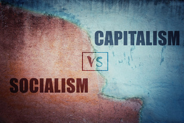 Socialism versus capitalism split concrete wall - obrazy, fototapety, plakaty
