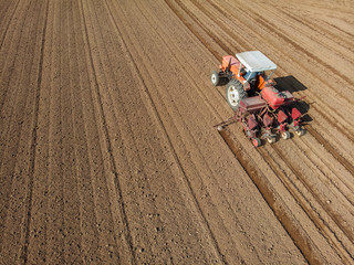 Tractor plowing the fields, aerial view, plowing, sowing, harvest. Agriculture and Farming,...