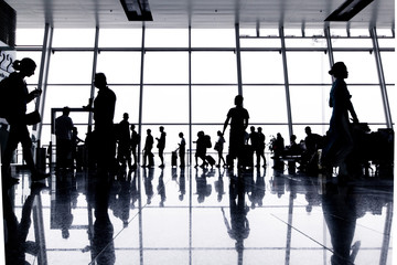 People in airport, silhouette of traveler